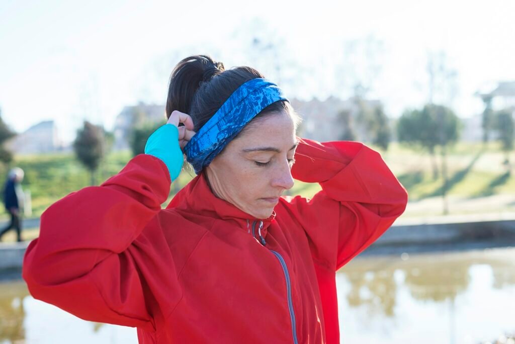 Headband Wig Portrait of mature runner woman with sport headband in the park